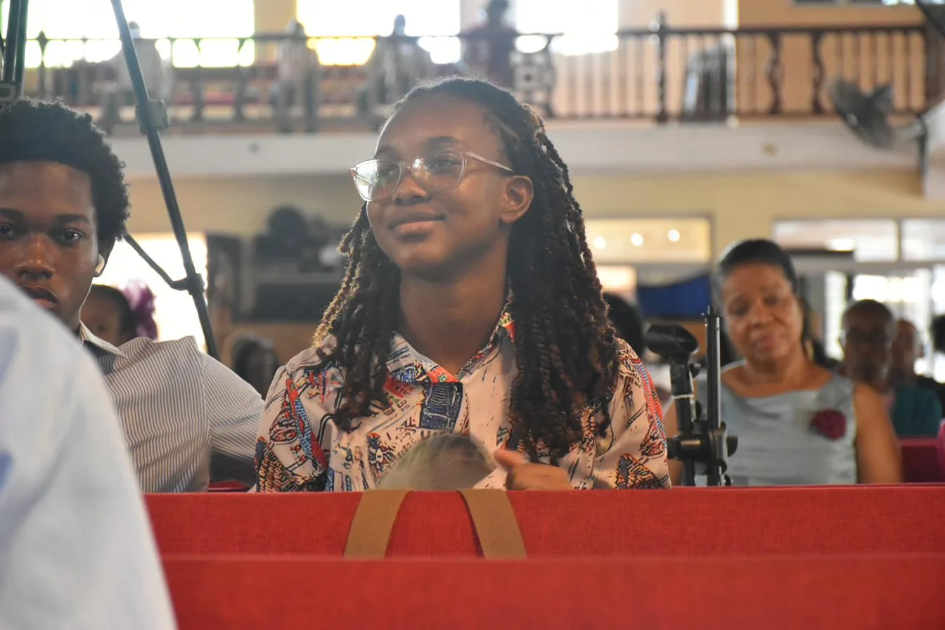 A member of the congregation listening to the sermon